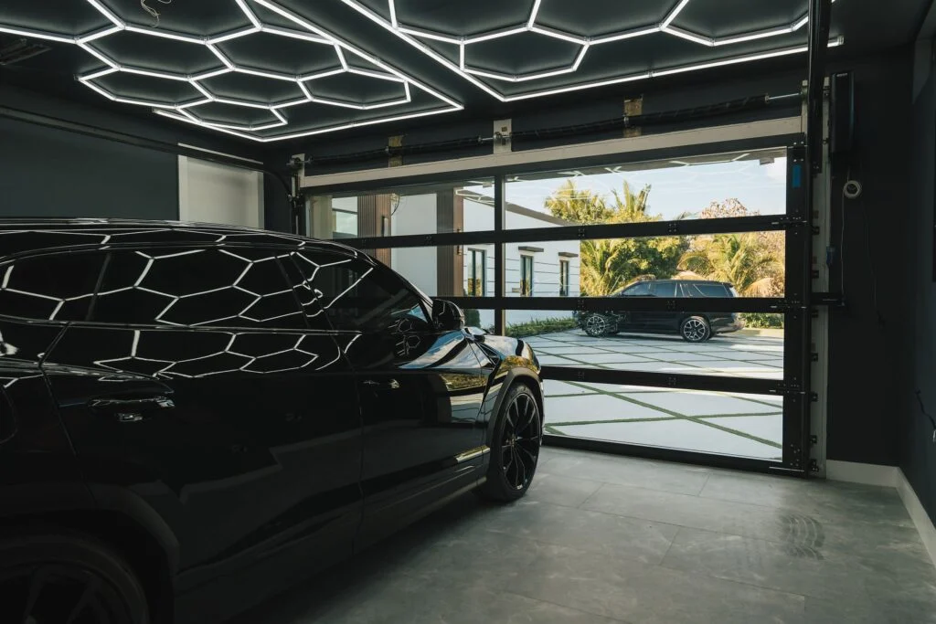 Inside a garage looking out through a Dubai Framed glass garage door