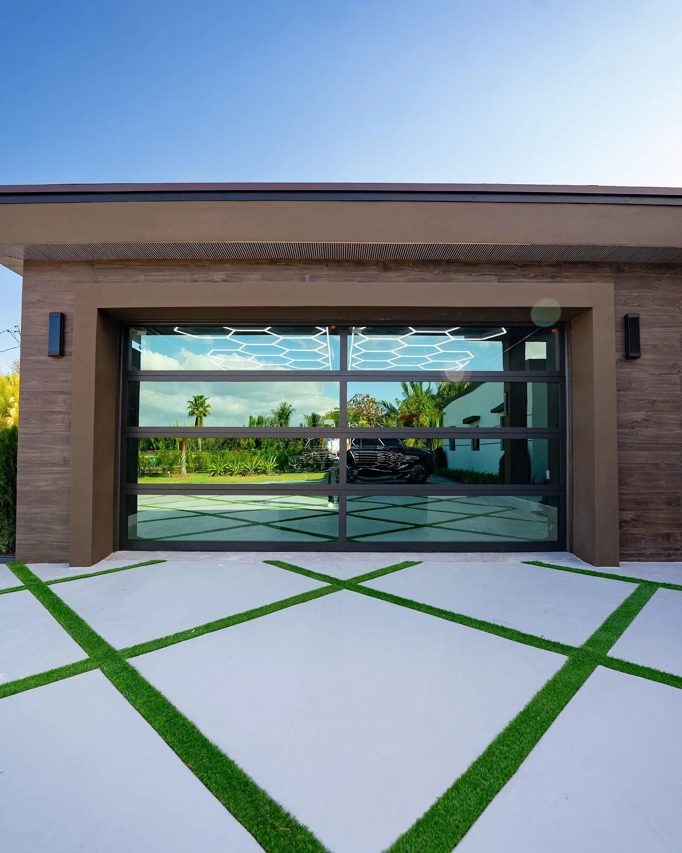 The same opening after installation of a two-car Dubai Framed glass garage door